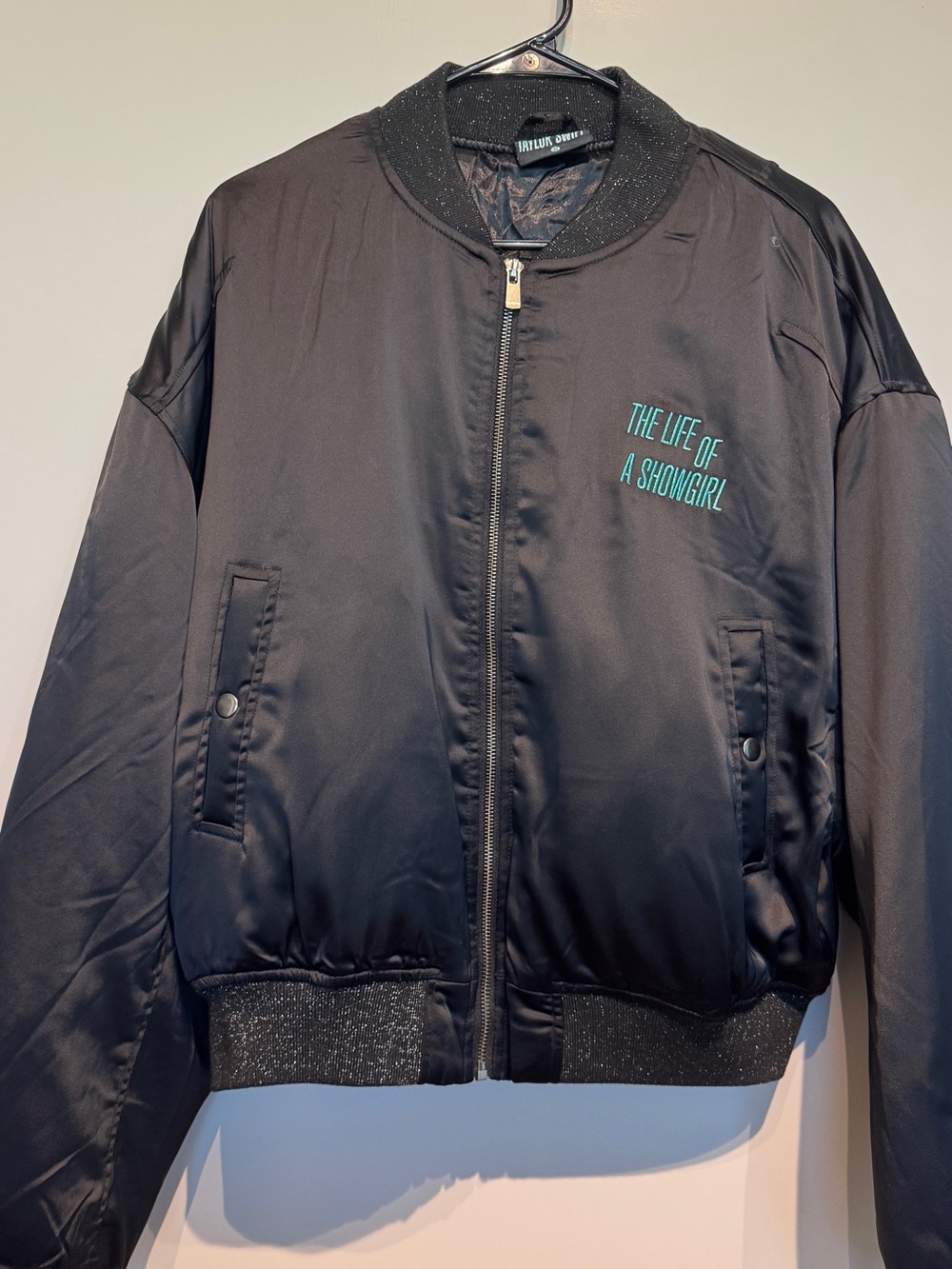 Taylor Swift Black Bomber Jacket with Teal Embroidery - The Life of a Showgirl